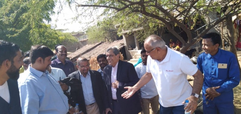 Dr. Camillus walking with group in Tuvar, India