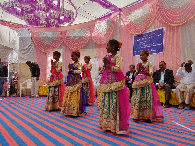 Women dancing in colorful sarongs at Opening Event in Tuvar, India