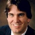 Dr. Joseph Mahoney - Head shot of smiling caucasian man with dark hair