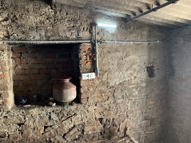 LED light mounted on wall in stone home